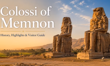 Colossi of Memnon statues on the West Bank of Luxor at golden hour